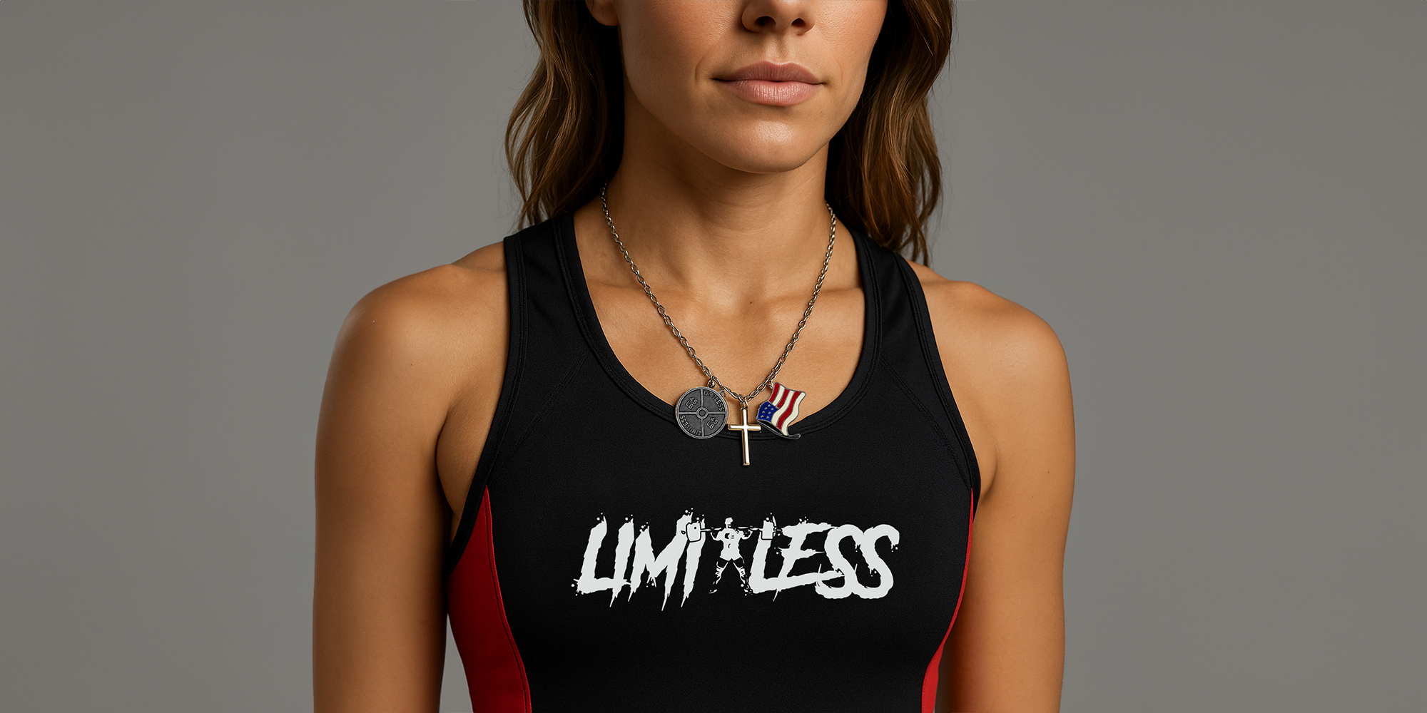 Person wearing a black tank top with 'LIMITLESS' text on a gray background