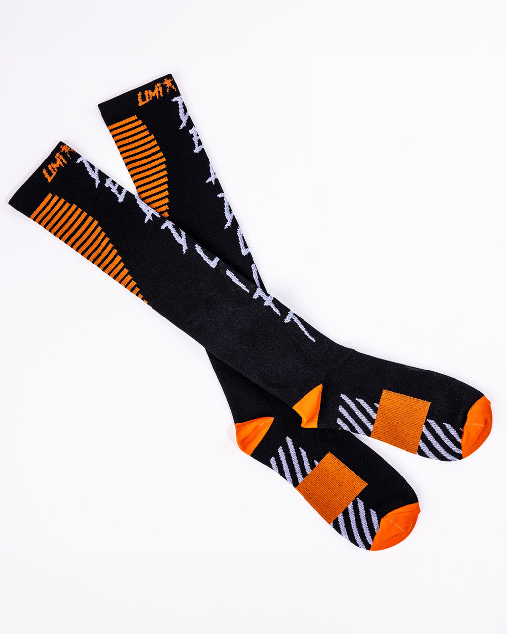 Limitless Black deadlift socks with orange and white patterns on a white background