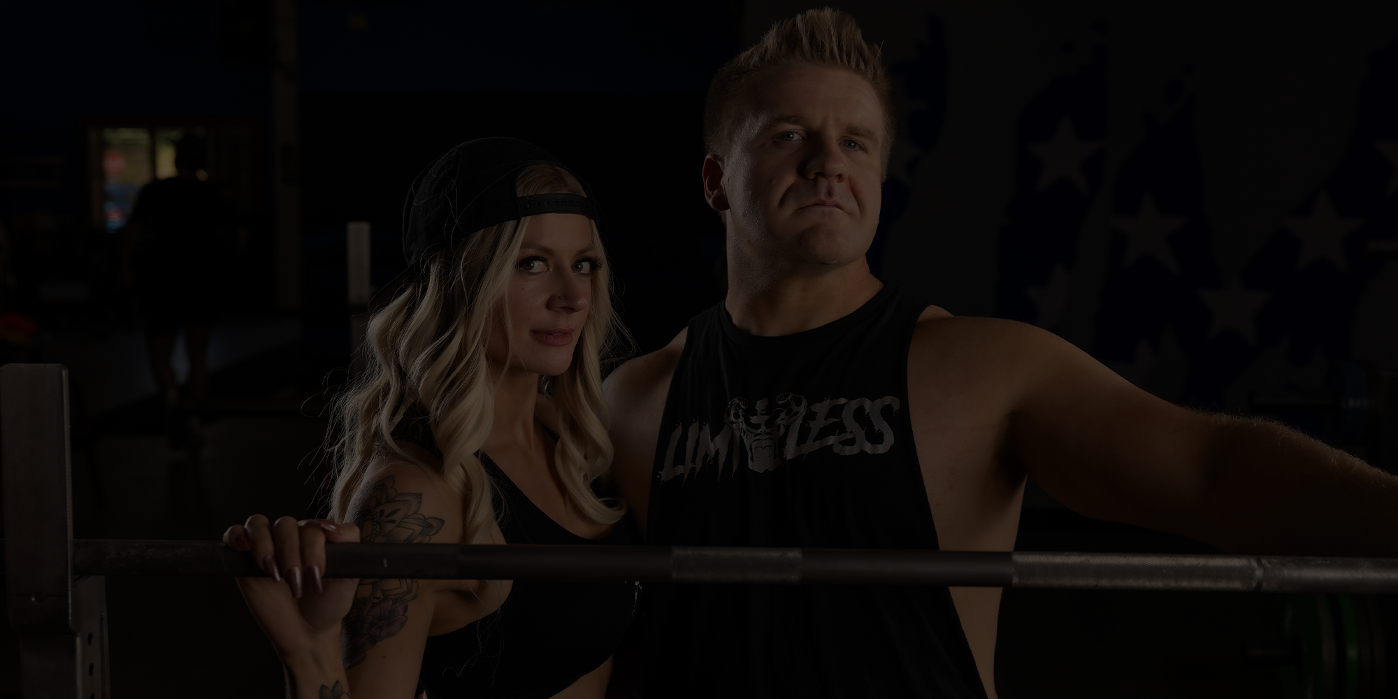 Quintin and Sara Meyer posing in front of a barell at Limitless