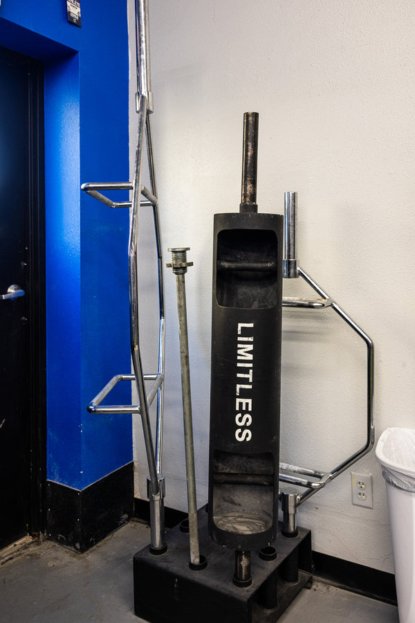 Back extension and strength bench area at Limitless Elite Gym