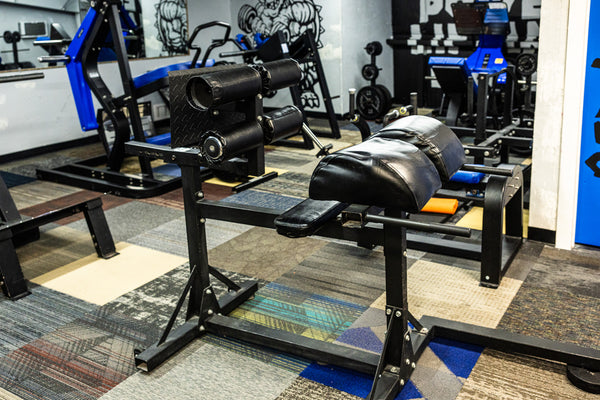 Leg press near power racks in strength room