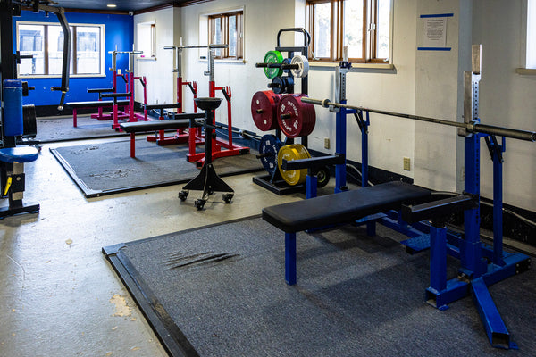 Dedicated deadlift area with bars and plates