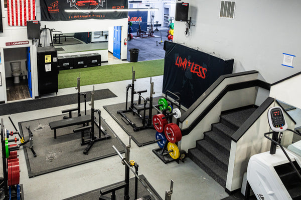 Wide lineup of squat racks and lifting platforms