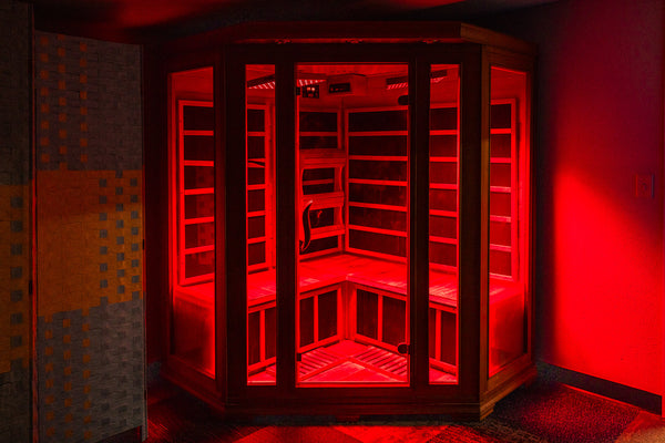 Red light booth glowing red in dark room