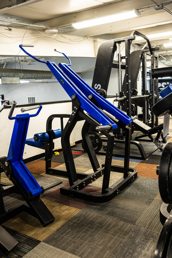 Squat rack and bench setup in lifting room
