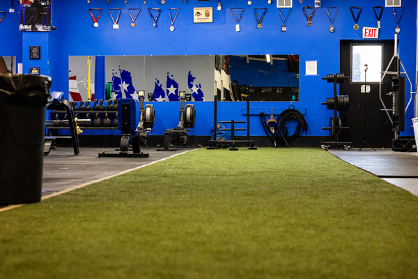 Panorama of the turf and strength training room at Limitless Elite Gym
