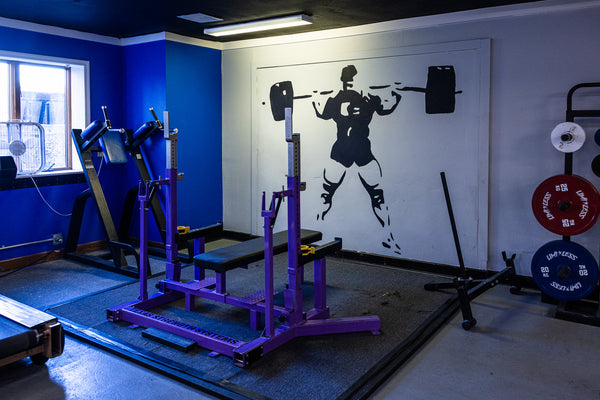 USAPL squat platform with power bar and calibrated plates