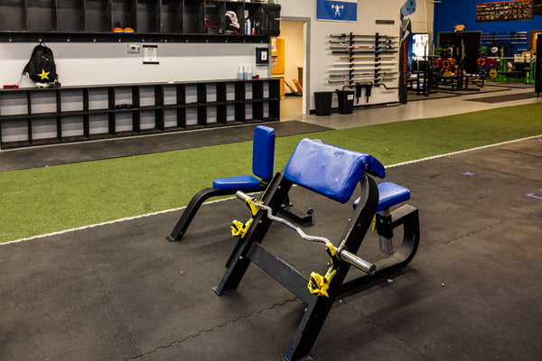Back extension and strength bench area at Limitless Elite Gym
